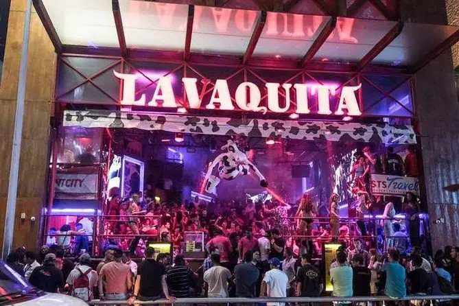 La Vaquita bar in Cancun with cow-themed décor and lively patrons.